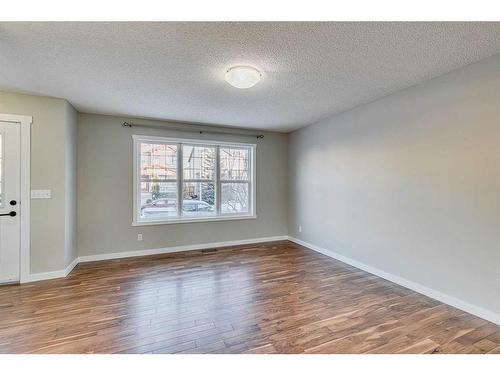 167 Silverado Plains Circle Sw, Calgary, AB - Indoor Photo Showing Living Room With Fireplace