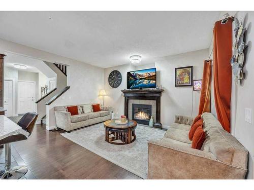 28 Saddlebrook Landing Ne, Calgary, AB - Indoor Photo Showing Living Room With Fireplace