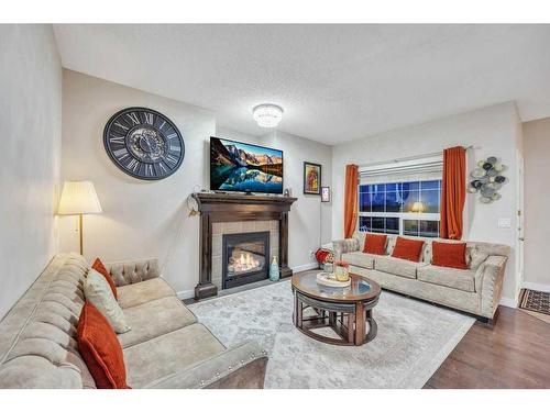 28 Saddlebrook Landing Ne, Calgary, AB - Indoor Photo Showing Living Room With Fireplace