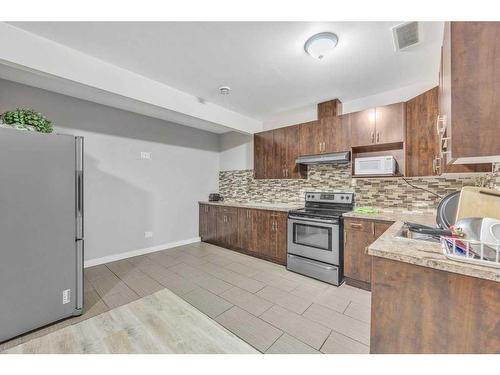 28 Saddlebrook Landing Ne, Calgary, AB - Indoor Photo Showing Kitchen With Double Sink With Upgraded Kitchen