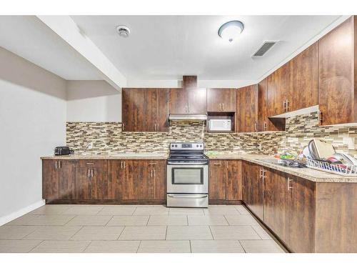 28 Saddlebrook Landing Ne, Calgary, AB - Indoor Photo Showing Kitchen With Double Sink With Upgraded Kitchen