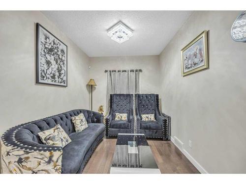 28 Saddlebrook Landing Ne, Calgary, AB - Indoor Photo Showing Other Room With Fireplace