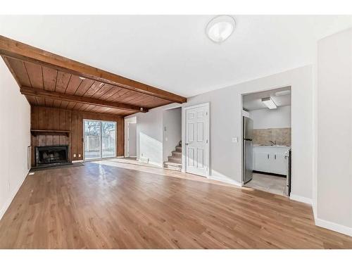 324-5404 10 Avenue Se, Calgary, AB - Indoor Photo Showing Living Room With Fireplace