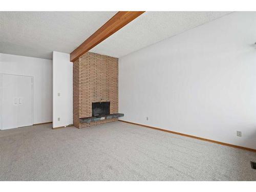 3903 Charleswood Drive Nw, Calgary, AB - Indoor With Fireplace