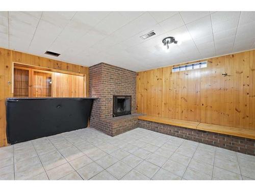 3903 Charleswood Drive Nw, Calgary, AB - Indoor Photo Showing Other Room With Fireplace