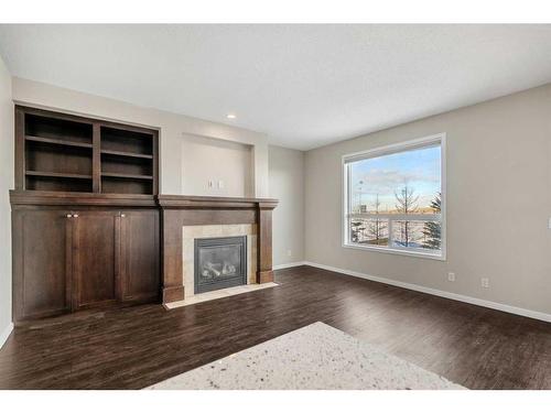 110 Brightoncrest Grove Se, Calgary, AB - Indoor Photo Showing Living Room With Fireplace