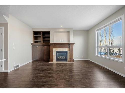 110 Brightoncrest Grove Se, Calgary, AB - Indoor Photo Showing Living Room With Fireplace