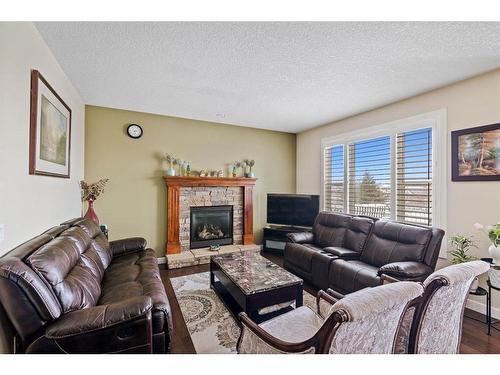 173 Everoak Circle Sw, Calgary, AB - Indoor Photo Showing Living Room With Fireplace