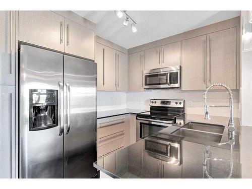 1403-11 Mahogany Row Se, Calgary, AB - Indoor Photo Showing Kitchen With Double Sink