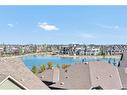 1403-11 Mahogany Row Se, Calgary, AB  - Outdoor With Body Of Water With View 