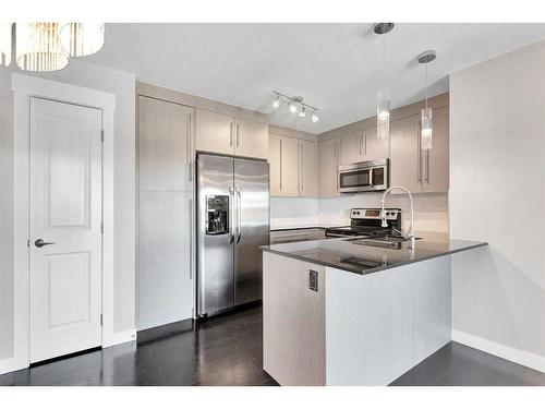 1403-11 Mahogany Row Se, Calgary, AB - Indoor Photo Showing Kitchen With Double Sink