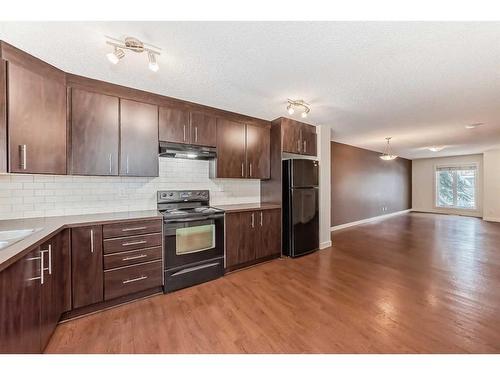 1703-2445 Kingsland Road Se, Airdrie, AB - Indoor Photo Showing Kitchen