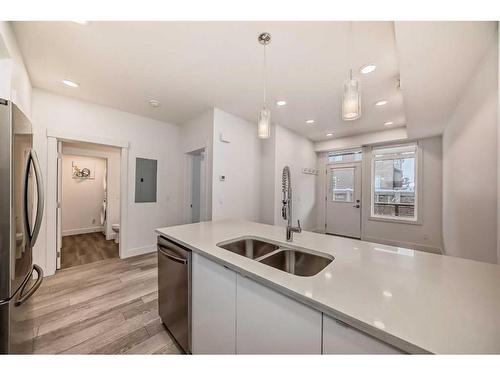 506-10060 46 Street Ne, Calgary, AB - Indoor Photo Showing Kitchen With Double Sink