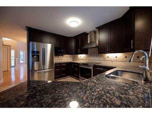 8 Arbour Glen Close Nw, Calgary, AB - Indoor Photo Showing Kitchen With Double Sink