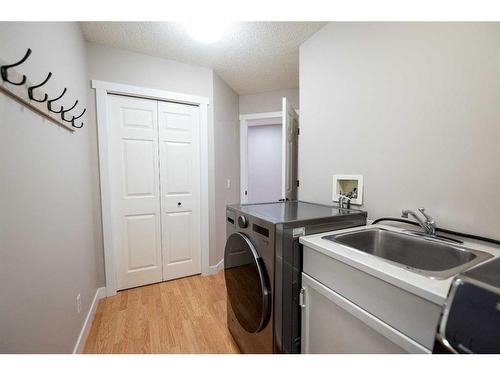 8 Arbour Glen Close Nw, Calgary, AB - Indoor Photo Showing Laundry Room