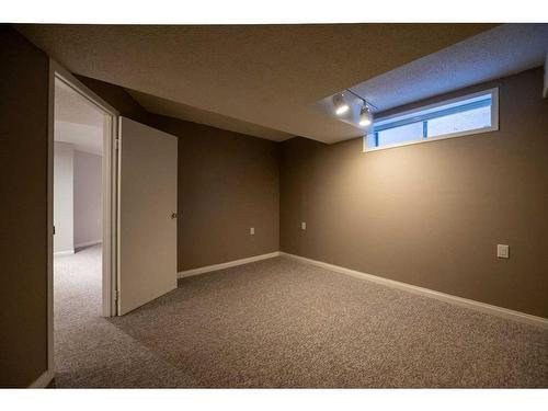 8 Arbour Glen Close Nw, Calgary, AB - Indoor Photo Showing Basement