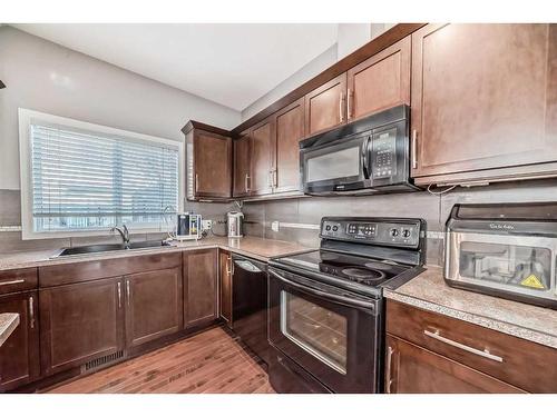 175 Kincora Heath Nw, Calgary, AB - Indoor Photo Showing Kitchen With Double Sink