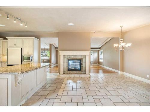 307 Wildwood Drive Sw, Calgary, AB - Indoor Photo Showing Kitchen With Fireplace