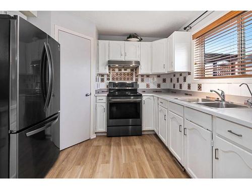 161 Country Hills Way Nw, Calgary, AB - Indoor Photo Showing Kitchen With Double Sink