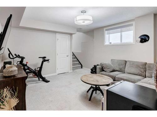 239 Sunset Point, Cochrane, AB - Indoor Photo Showing Living Room