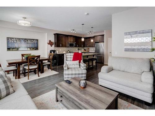 239 Sunset Point, Cochrane, AB - Indoor Photo Showing Living Room