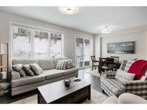 239 Sunset Point, Cochrane, AB - Indoor Photo Showing Living Room