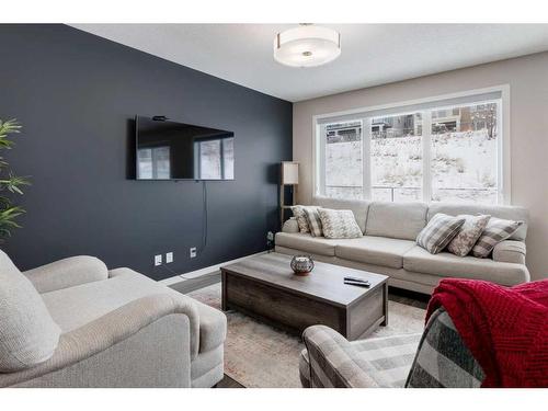 239 Sunset Point, Cochrane, AB - Indoor Photo Showing Living Room