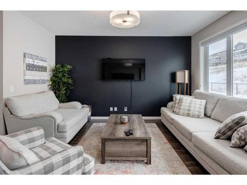 239 Sunset Point, Cochrane, AB - Indoor Photo Showing Living Room