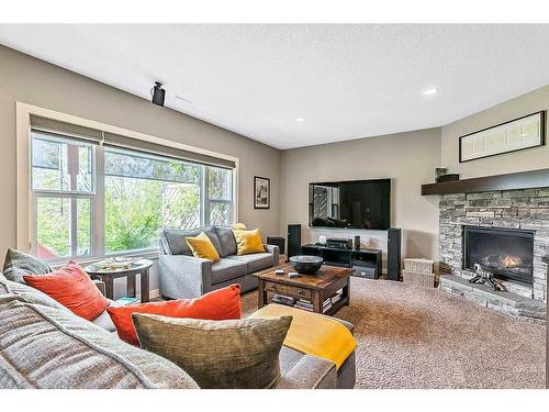 79 Cranbrook Way Se, Calgary, AB - Indoor Photo Showing Living Room With Fireplace