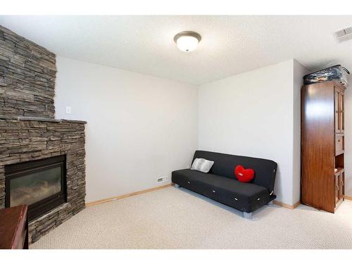 152 Martin Crossing Crescent Ne, Calgary, AB - Indoor Photo Showing Other Room With Fireplace