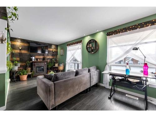 3607 28A Avenue Se, Calgary, AB - Indoor Photo Showing Living Room With Fireplace