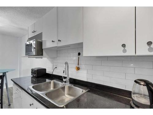 11A-80 Galbraith Drive Sw, Calgary, AB - Indoor Photo Showing Kitchen With Double Sink