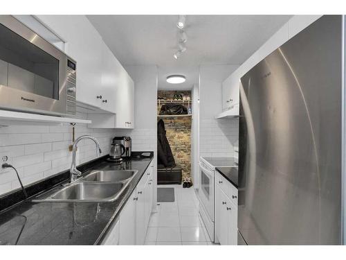 11A-80 Galbraith Drive Sw, Calgary, AB - Indoor Photo Showing Kitchen With Double Sink