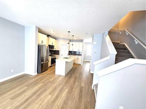 1197 Iron Ridge Avenue, Crossfield, AB - Indoor Photo Showing Kitchen