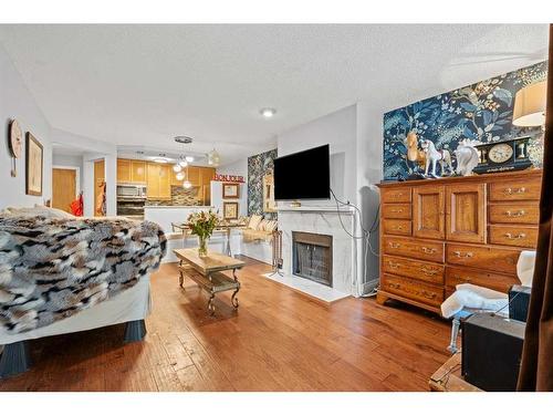 103-1111 13 Avenue Sw, Calgary, AB - Indoor Photo Showing Living Room With Fireplace