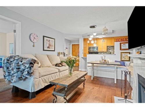 103-1111 13 Avenue Sw, Calgary, AB - Indoor Photo Showing Living Room With Fireplace