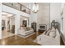 40 Masters Landing Se, Calgary, AB  - Indoor Photo Showing Living Room With Fireplace 