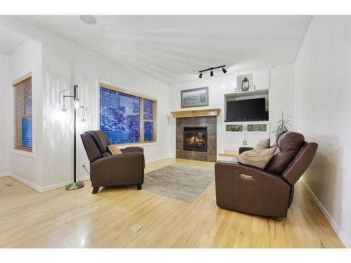 206 Discovery Ridge Way Sw, Calgary, AB - Indoor Photo Showing Living Room With Fireplace