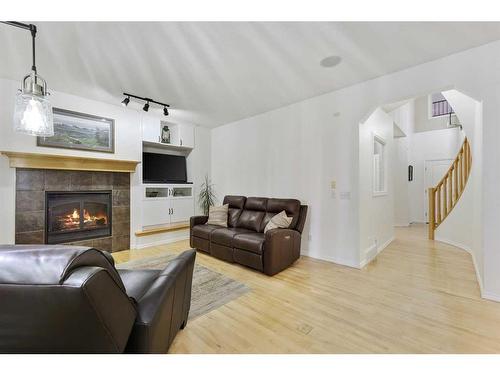 206 Discovery Ridge Way Sw, Calgary, AB - Indoor Photo Showing Living Room With Fireplace