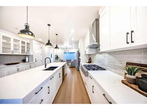 390 Hendon Drive Nw, Calgary, AB - Indoor Photo Showing Kitchen With Double Sink With Upgraded Kitchen