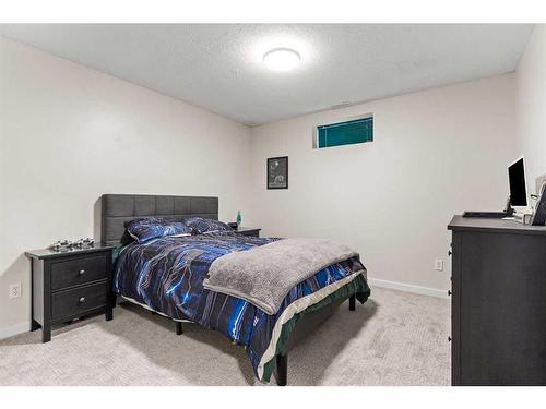 148 Woodbend Way, Okotoks, AB - Indoor Photo Showing Bedroom