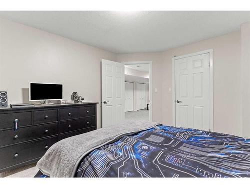 148 Woodbend Way, Okotoks, AB - Indoor Photo Showing Bedroom