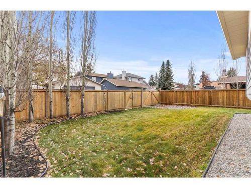 148 Woodbend Way, Okotoks, AB - Outdoor With Backyard