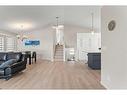 148 Woodbend Way, Okotoks, AB  - Indoor Photo Showing Living Room 