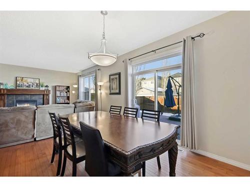 83 Copperstone Boulevard Se, Calgary, AB - Indoor Photo Showing Dining Room With Fireplace