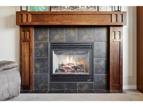 83 Copperstone Boulevard Se, Calgary, AB - Indoor Photo Showing Living Room With Fireplace