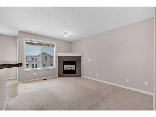 19 Royal Crest Court Nw, Calgary, AB - Indoor Photo Showing Living Room With Fireplace