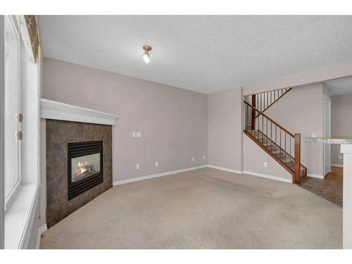 19 Royal Crest Court Nw, Calgary, AB - Indoor With Fireplace