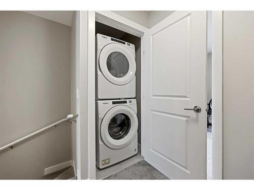 211 Livingston Common Ne, Calgary, AB - Indoor Photo Showing Laundry Room