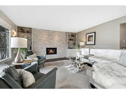 2407 Juniper Road Nw, Calgary, AB - Indoor Photo Showing Living Room With Fireplace